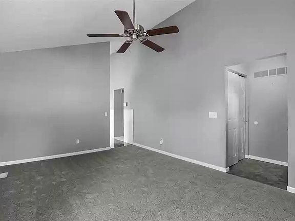 living room with vaulted ceiling