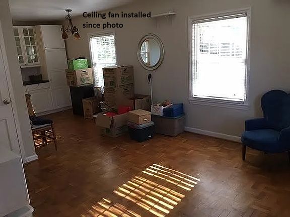 Living room looking towards the back door. Ceiling fan installed since this photo was taken.