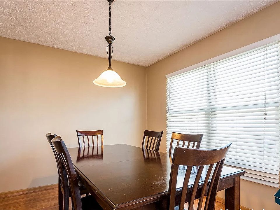Bright dining space with large windows, ample natural light, and an open layout ideal for daily meals or entertaining.