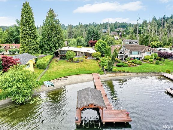 Private dock with rare, covered boat slip (no longer being permitted on the lake).  Note the boat/jet ski lift! 