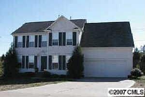 Front view of this lovely home w/berber carpet and fresh neutral paint through