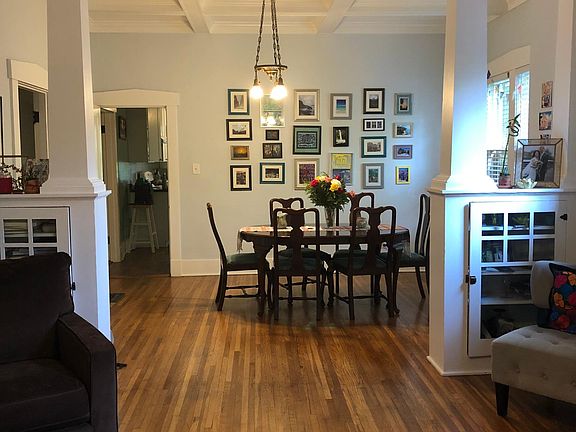 View from front door looking into living space and dining room area