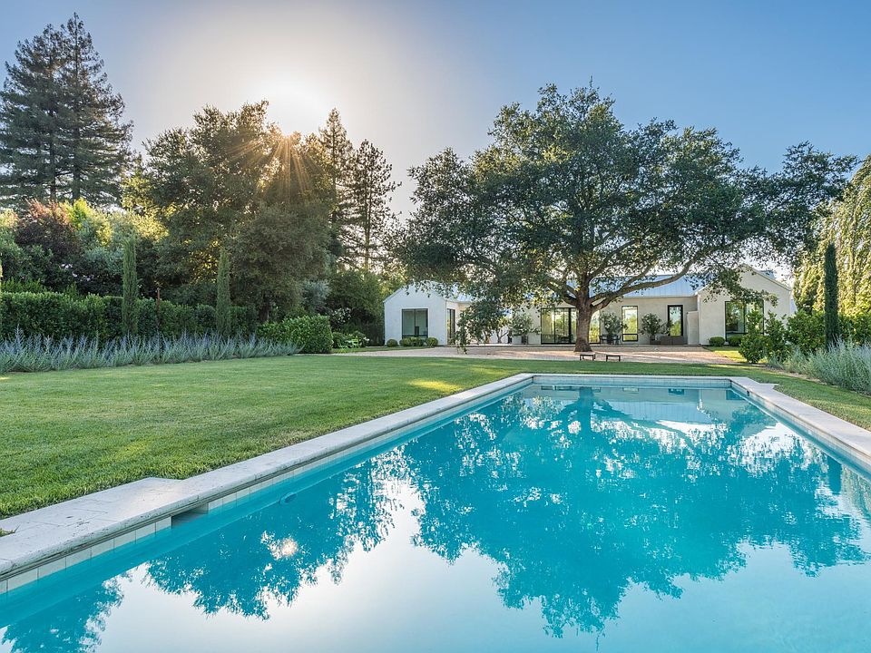 heated pool in rear garden with vineyard views