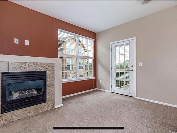 Living Room fireplace and balcony door