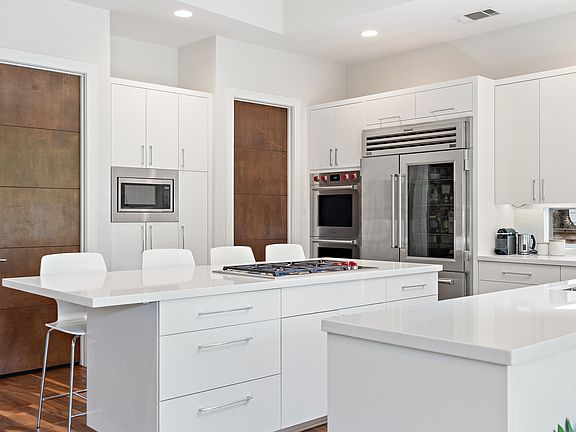 Clean lines and soft-close cabinets with fresh quartz counte