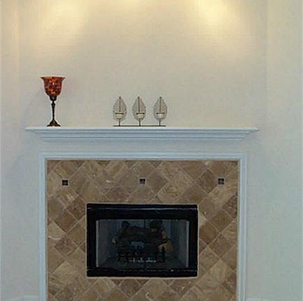 Beautiful gaslog fireplace in den