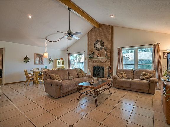 Living room with vaulted ceiling that overlooks the private backyard!