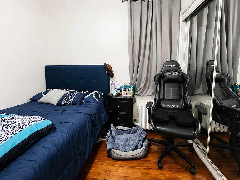 2nd Bedroom, also with full frame mirrors to right and closet.