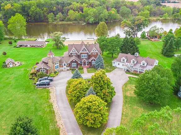 Circular driveway leads to all structures.
