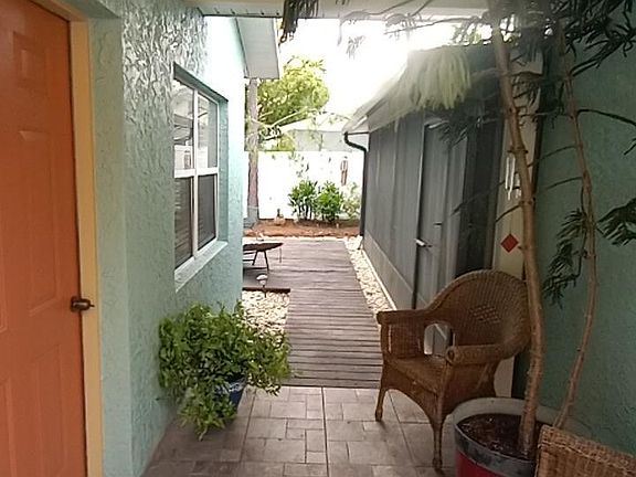 Breezeway porch. Shared laundry facility just through screened porch. Polite communication with owner allows easy access.
