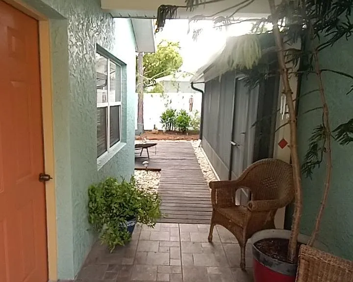Breezeway porch. Shared laundry facility just through screened porch. Polite communication with owner allows easy access.