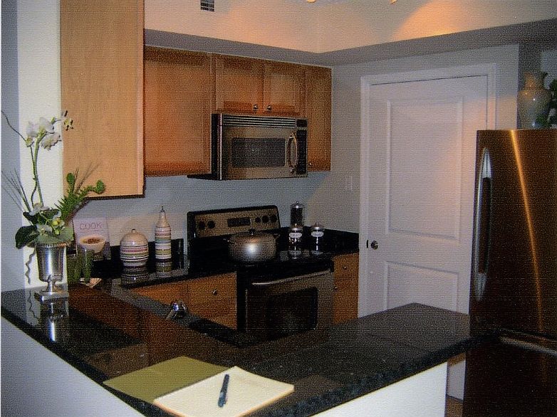 Open kitchen w/granite & SS