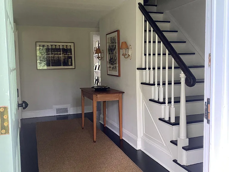 front hall and front staircase leading to main bedroom #1