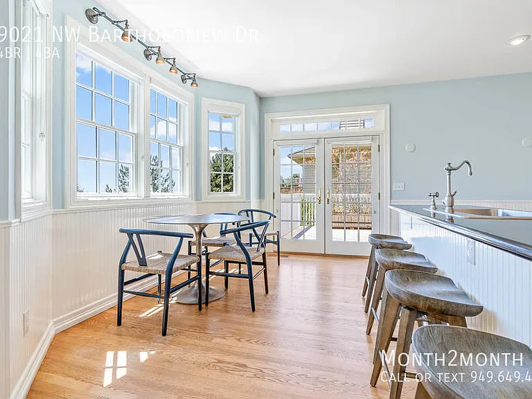 9021 NW Bartholomew Dr — Photo 16