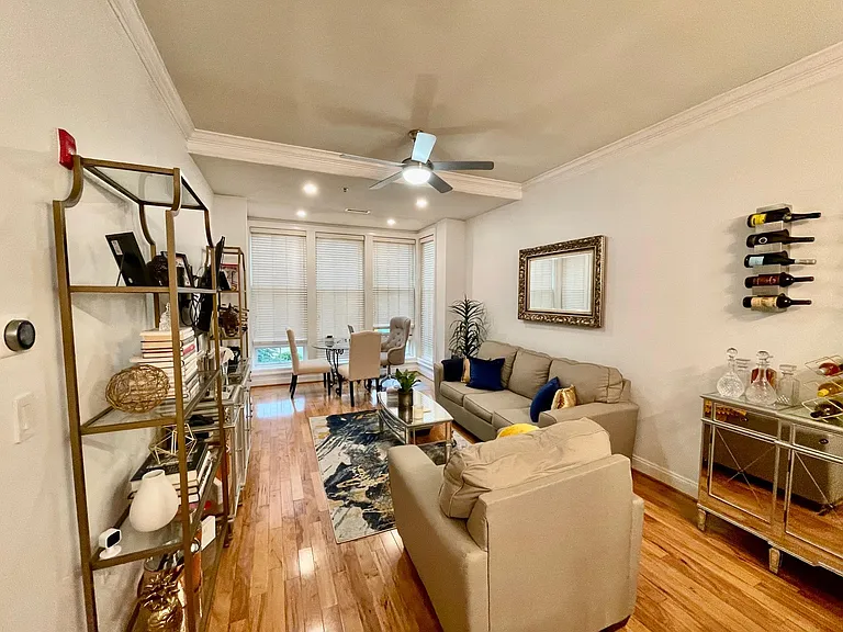 Living Room facing Dining Area w/ a Wall of Windows.