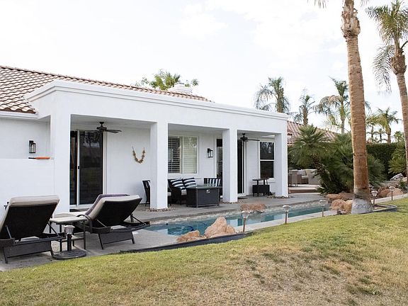 View of the home and pool area from the golf course.