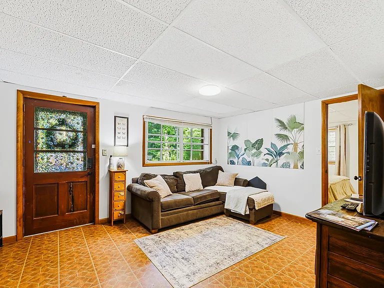 TERRACE LEVEL: Living Room (Kitchen to left, Bedroom to right, Bathroom behind camera)