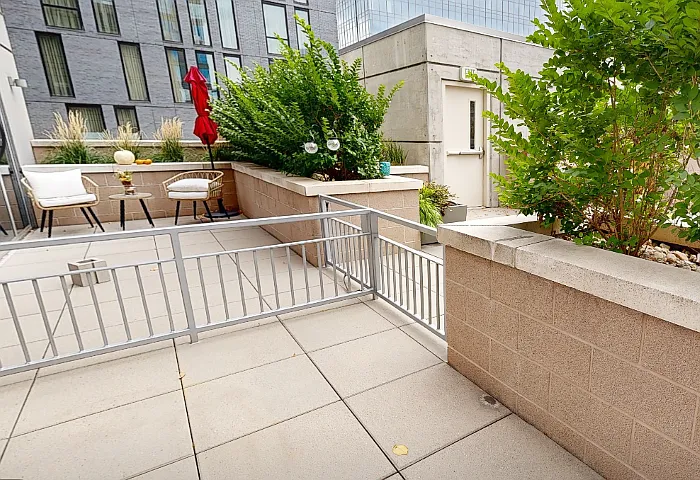 Apartment balcony with cement flooring