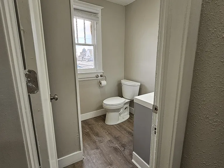 New bathroom with quartz countertops and tons of built-in storage.