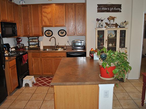 View of the kitchen after walking in front door.