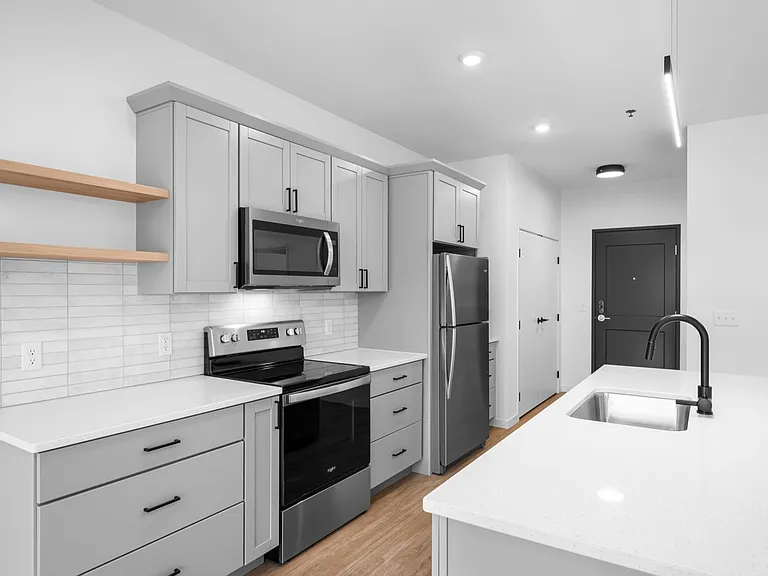 Sleek, modern kitchen with stainless steel appliances, quartz countertops, and stylish cabinetry. Sleek, modern kitchen with stainless steel appliances, quartz countertops, and stylish cabinetry.
