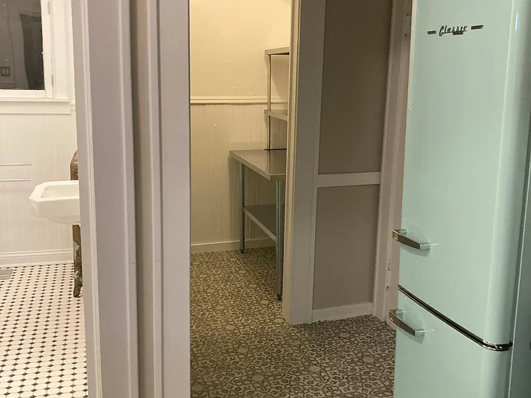 Kitchen to pantry and rear entry/ shared laundry