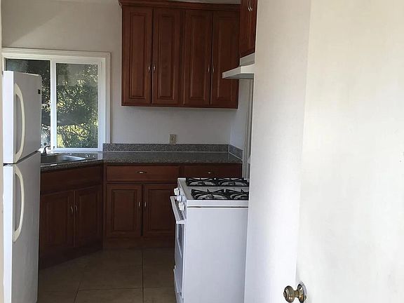 View of kitchen from second bedroom.