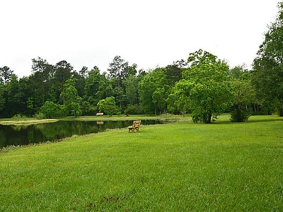 Behind the home behind the trees amazing lake to relax on the sitting bench and more, come to the good life!