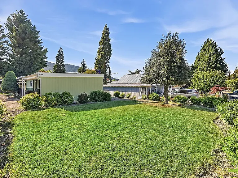 Front Yard. Low maintenance Sprinkler system and drip lines. Property is Completely fence.