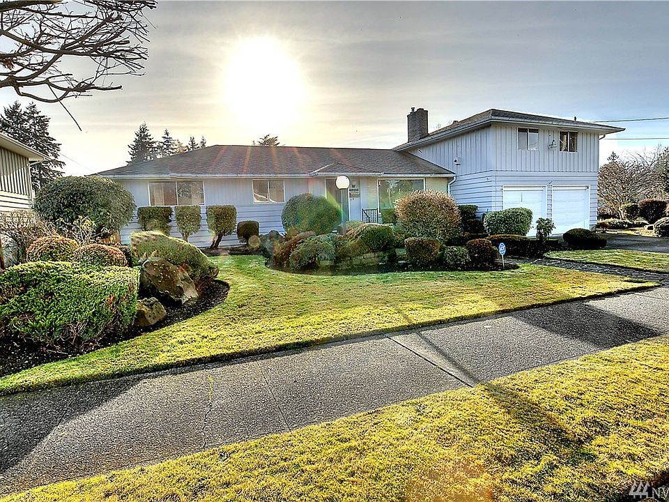 Rambler with bonus space above the garage is located on a corner lot.