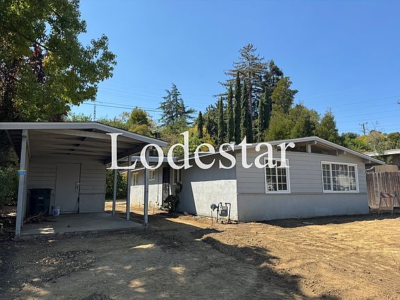 Front of house, carport, storage