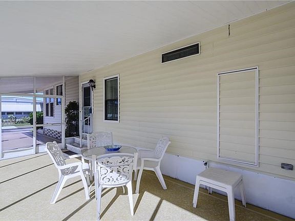 Large screened lanai for outdoor living and entertaining.