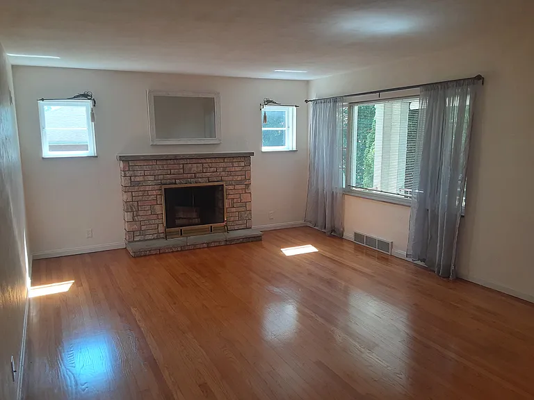 LR Hardwood flooring restored + pale grey sheers