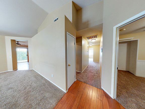 Living room, central hallway, and bedroom 3 from front door