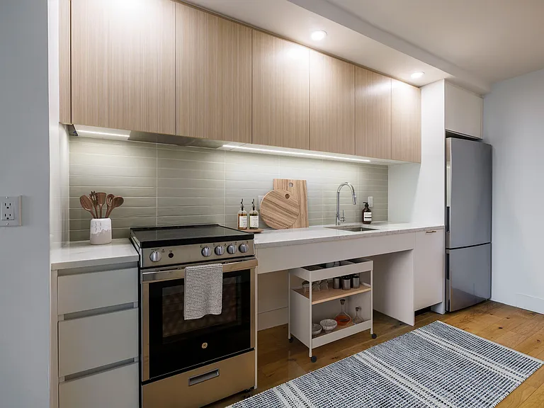 Elevate your lifestyle at 240 Willoughby, where modern design meets functional elegance. This stunning kitchen boasts sleek cabinetry and top-notch appliances, perfect for culinary adventures. Schedule a tour today and make this space your own!