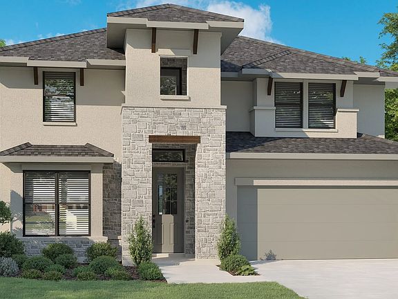 Exquisite stone facade with sleek lines and lush landscaping in Preserve at Lakeside Meadows. Luxuri