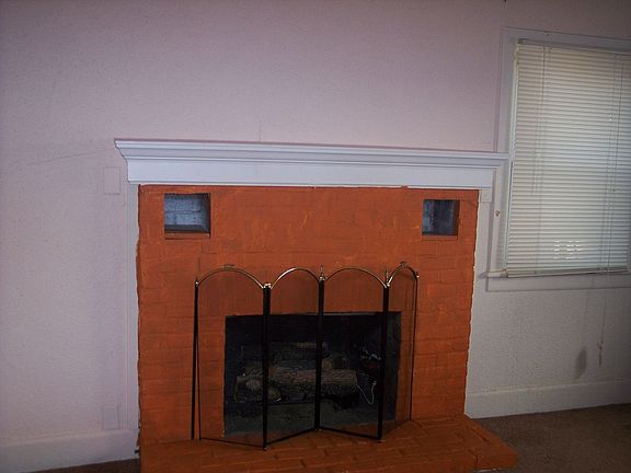 Gas logs in brick fireplace