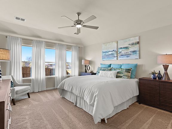 Primary bedroom in the Heisman home plan by Trophy Signature Homes - REPRESENTATIVE PHOTO