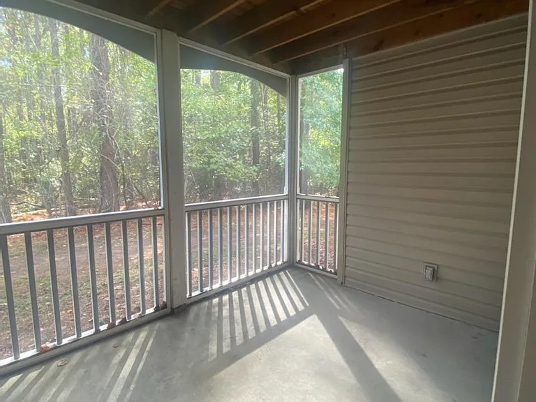 Screened porch with views into the woods