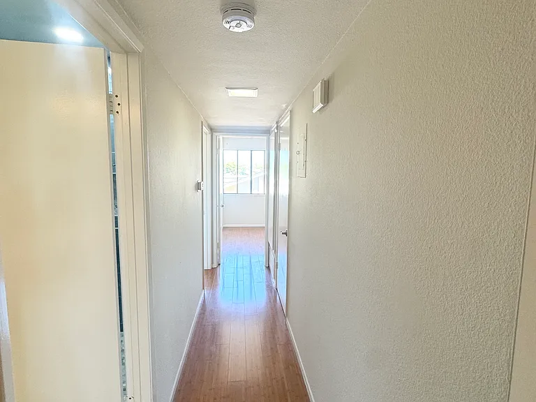 Hallway to bedrooms and bathrooms