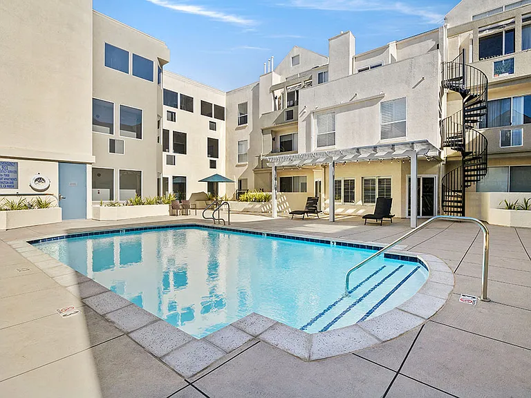 Gorgeous courtyard pool and lounging space at Clarington Court Apartments