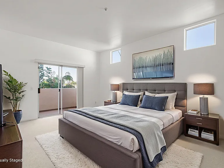 Master bedroom on third floor with large west facing balcony.