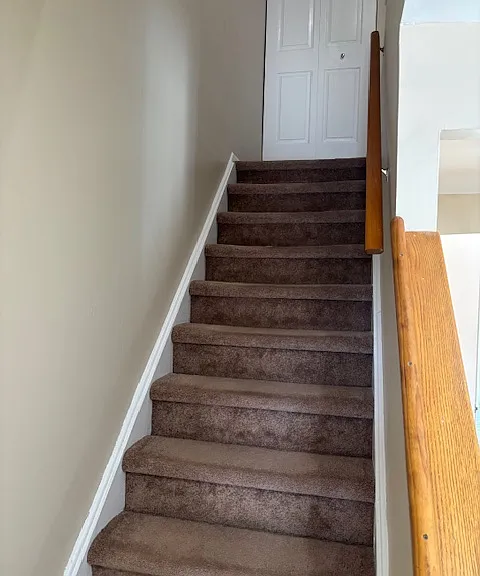 Stairwell leading up to closet on second floor