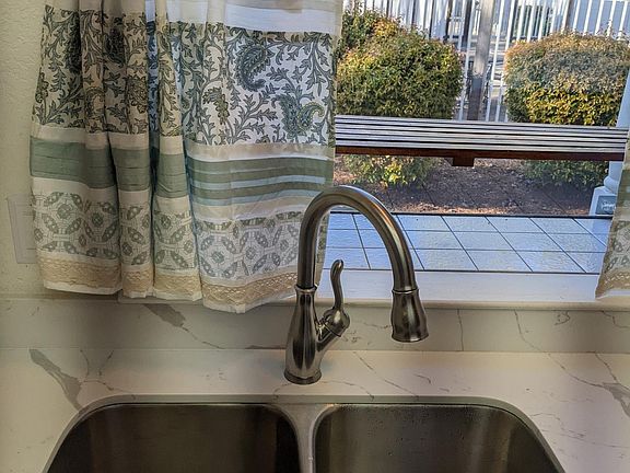 Brand new sink! Cute kitchen window!