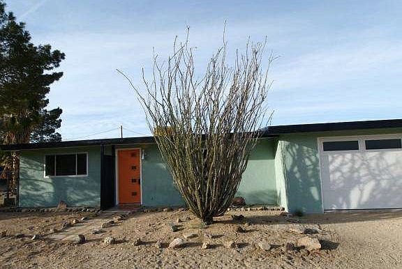 Beautifully restored mid century modern home, 2 bedroom, 1 bath on large lot, 1 car garage, covered carport and RV pad.