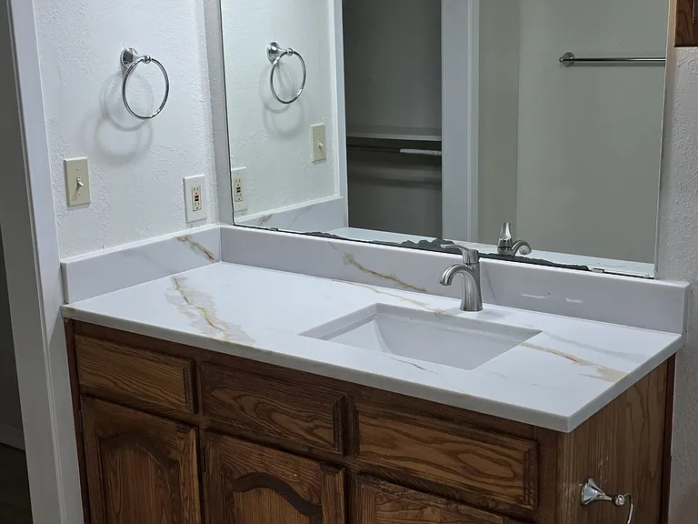 master bathroom vanity features new light, new quartz cts