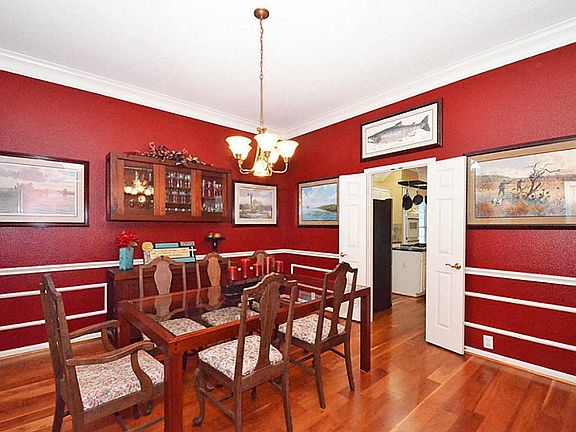 Formal dining with doors to kitchen.