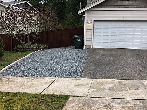 Extra driveway (extends to back yard) for guests and large f