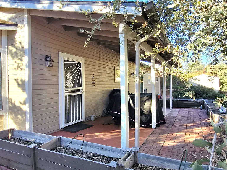 Roofed backyard porch