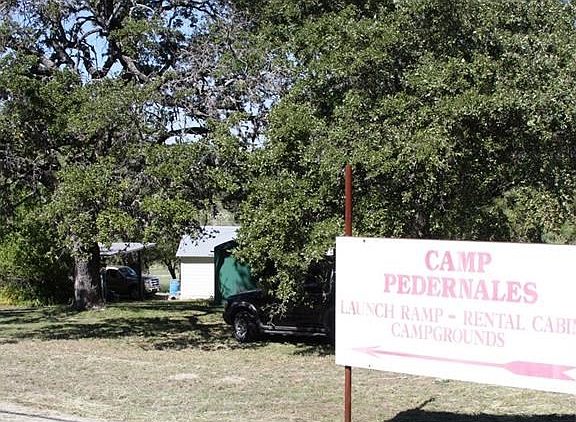 Corner lot of property.  House is to the left of the photo.  The green tank is 3000 gallon water storage.